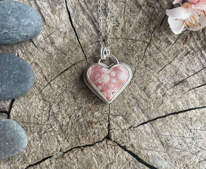 Galaxy Rhyolite heart pendant necklace designed for self-acceptance, emotional integration, and healing. Meaningful heart jewelry for inner growth.