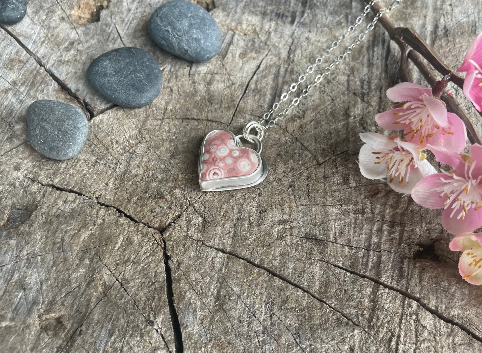 Galaxy Rhyolite heart pendant necklace designed for self-acceptance, emotional integration, and healing. Meaningful heart jewelry for inner growth.