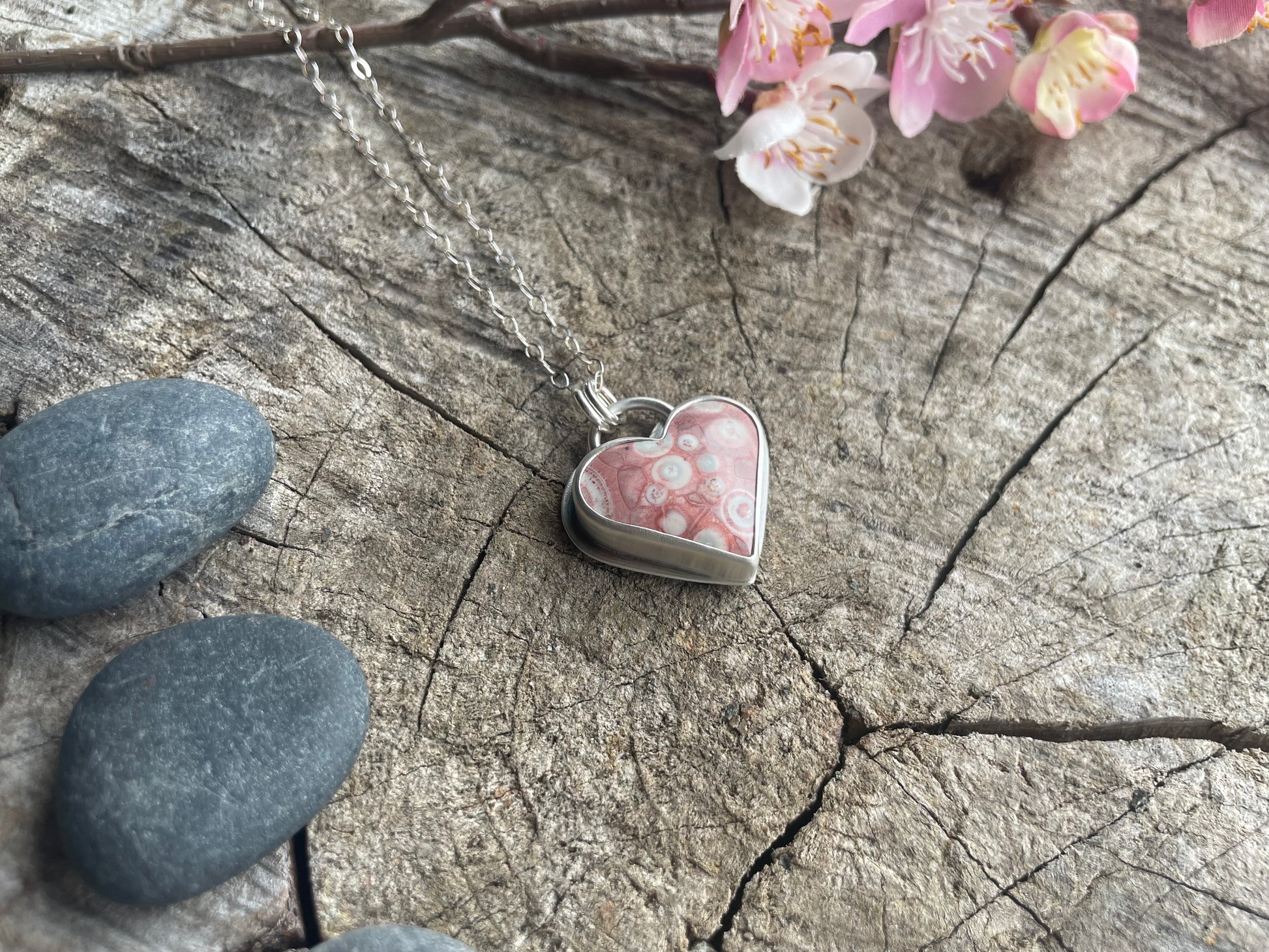 Galaxy Rhyolite heart pendant necklace designed for self-acceptance, emotional integration, and healing. Meaningful heart jewelry for inner growth.