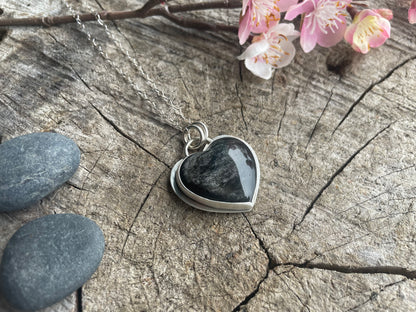 Silver sheen obsidian heart pendant necklace designed for reflection, clarity, and grounding. Meaningful heart jewelry to support inner truth.